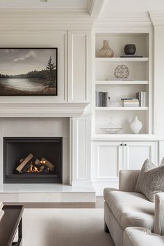 a living room filled with furniture and a fire place