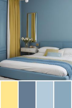 a bedroom with blue walls and yellow curtains