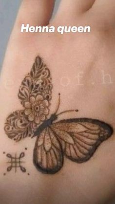 a woman's hand with a butterfly tattoo on it and the words henna queen written below