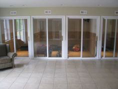 an empty living room with sliding glass doors