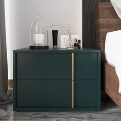 a bedroom with a green dresser next to a bed