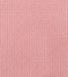 pink knitted fabric textured with small dots and lines, suitable for background or wallpaper