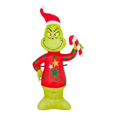 an inflatable christmas decoration with a grin face and stars on its chest, holding a candy cane