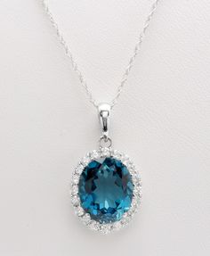 7.70 Carat Natural London Blue Topaz and Diamonds Women Necklace and Pendant Made in 14K Solid White Gold Suggested Retail Value $3,999.00 Topaz Measurements Approx - 12.00 x 10.00 mm Topaz Weight is - 7.00 Carat Total Diamond Carat Weight is - .70 Carat Diamond Clarity: SI1 Diamond Color: G-H Chains available in - 16 INCH TOTAL ITEM WEIGHT IS 3.5g Disclaimer: All colors, measurements and weights are approximate and may vary slightly from the listed dimensions or as seen in the image'' Oval Topaz Necklace For Formal Occasions, Formal Oval Topaz Necklace, Blue Brilliant Cut Gemstones For Formal Occasions, Luxury Oval Topaz Necklace, Formal Blue Brilliant Cut Gemstones, Formal Sapphire Necklaces With Accent Stones, Sapphire Necklaces With Accent Stones For Formal Occasions, Formal Oval Necklace With Accent Stones, Formal Topaz Necklace In Fine Jewelry Style