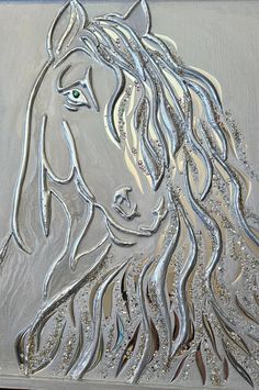 a horse with long hair and green eyes is depicted in this glass art piece that has been made to look like silver foil