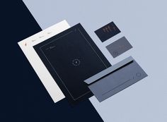 an assortment of stationery items including envelopes and business cards