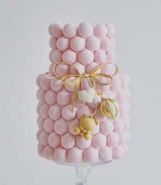 a cake made out of marshmallows with a bow on it's top