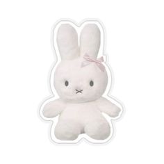 a white stuffed animal with a pink bow on it's head, sitting in front of a white background