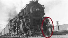 an old black and white photo with a red circle in front of a train engine