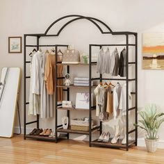 Transform your cluttered space into a stylish and functional wardrobe with the Dextrus heavy duty clothes rack. This isn't just a clothes rack. It's a closet system engineered for maximum efficiency. With three robust hanging rods and six shelves, you'll have ample room for everything from your favorite dresses to everyday essentials. Constructed with a robust iron frame, our closet organizer offers outstanding strength and longevity. Say goodbye to chaotic closets and hello to a beautifully org Shelf Clothing Rack, Storage Closet Shelving, Standing Closet, Closet Clothes Storage, Chic Organization, Clothes Hanger Rack, Heavy Duty Clothes Rack, Versatile Clothing, Closet Organizing Systems