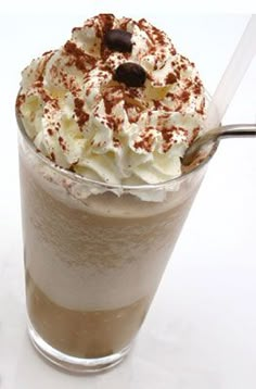 there is a drink with whipped cream and chocolate on top