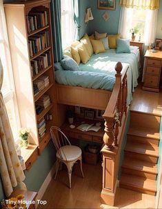 a small bedroom with stairs leading up to the bed and bookshelves in it