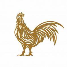 a golden rooster standing on top of a white surface