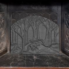 the fireplace is decorated with intricate carvings