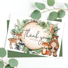 a thank card with woodland animals and greenery around it, on top of a white background