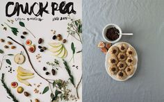 the cover of chick pea magazine next to a plate of fruit and nuts on a table