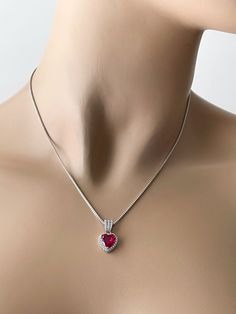 Sterling Silver Ruby Red Heart Necklace. Ruby Heart CZ Pendant 925 Sterling Silver Stone: Ruby Pendant Height 10.5 mm Pendant Width 10.5 mm Pendant Shape: Heart The Vibrant Ruby Epitomizes: Strength, Confidence, Integrity & Boldness Includes a Sterling Silver Chain (16, 18, or 20 Inches). Ruby Red Necklace, Red Heart Necklace, Necklace Ruby, Ruby Heart, Gold Jewellry, Ruby Pendant, Red Necklace, Cz Necklace, Cz Pendant