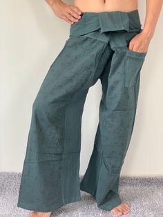 "Unisex Thai fisherman pants. One size fits all. You can wear in many occasions, casual wear, yoga wear, relax at home, travel etc. If you are looking for some pants that you can wear everywhere, comfortable, relax and Easy to wear. Thai fisherman pants is Answer!! Nice gift for yourself or your lover One pocket on the side for storing your items such as wallets, mobile phones, etc Approx. Measurements: One size can fits most and 1 Pockets Waist around 51\" (Wrap Pants) Length 45\" Lower Leg 14\ Cotton Harem Yoga Pants With Pockets, Casual Cotton Harem Yoga Pants, Casual Yoga Harem Pants Wide-leg, Casual Yoga Harem Pants With Wide Legs, Casual Wide-leg Harem Yoga Pants, Casual Harem Yoga Pants With Pockets, Casual Yoga Harem Pants With Pockets, Hippie Cotton Bottoms For Meditation, Casual Wide Leg Harem Pants For Yoga