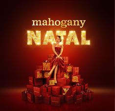 a woman in a red dress is sitting on top of presents with the words mahogany natal