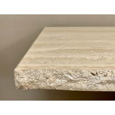 a close up view of a stone table top with no one on it or in the background