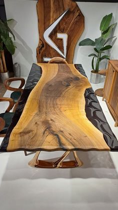 a wooden table with black and brown designs on it