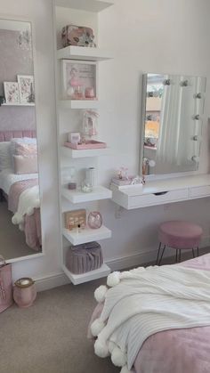 a bedroom with a bed, desk and mirror