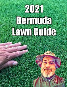 a hand reaching out to a lawn with a photo of a man's face on it