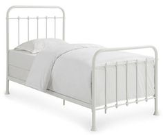 a white metal bed frame with no headboard