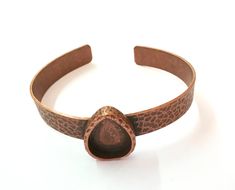 Material Wrist strap : Brass Blank : zinc alloy Nickel Free and Lead Free Color: Antique Copper Wristband Width : 10mm Blank Size : 18x13 mm Drop blank inner depth : 3 mm Quantity : 1 pc. To see other all Silver Bracelet Blanks please click below https://www.etsy.com/shop/AZsupplies/search?search_query=bracelet+blank+silver&order=date_desc&view_type=list&ref=shop_search To see other all Silver Ring Blanks please click below https://www.etsy.com/shop/AZsupplies/search?search_query=nic Adjustable Copper Teardrop Jewelry, Adjustable Teardrop Copper Jewelry, Adjustable Bronze Cuff Jewelry, Adjustable Stamped Metal Cuff Bracelet, Adjustable Metal Cuff Bracelet With Stamped Detail, Adjustable Oval Metal Bracelets, Bronze Copper Cuff Jewelry, Bronze Bracelets, Brass Bracelet