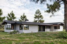 a modern house in the middle of a field