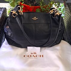 This New Beautiful Coach Lexy Black Pebble Leather Shoulder Bag With Gourgous Gold Hardware Adds Elegance To Your Wardrobe For Everyday Or Special Occasions. With 3 Separate Compartments, 1 With Center Zipper Compartment And 2 Magnetic Snaps With Several Pockets And Separate Zipper Compartment Inside. With The Beautiful Double Leather Handles With 10" Drop For Perfect Comfort. Comes With Dust Bag And Coach Care Card. Makes For The Excellent Gift. Retail Price $395 Nwot Everyday Pebbled Leather Shoulder Bag With Branded Hardware, Pebbled Leather Satchel Shoulder Bag With Branded Hardware, Daily Use Pebbled Leather Shoulder Bag With Branded Hardware, Branded Hardware Pebbled Leather Tote Bag, Coach Pebbled Leather Satchel With Gold-tone Hardware, Pebbled Leather Bags With Branded Hardware For Daily Use, Luxury Coach Pebbled Leather Shoulder Bag, Black Pebbled Leather Tote Shoulder Bag, Black Pebbled Leather Shoulder Bag With Branded Hardware