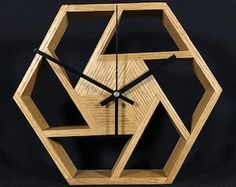 a clock made out of wood on a black background