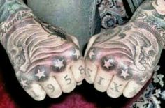 two hands that have tattoos on them and one has the word love written on it