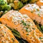 salmon and asparagus on a plate with broccoli