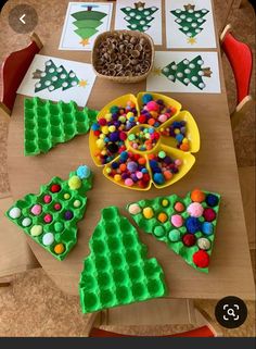 a table topped with lots of different types of cakes and candies on top of it