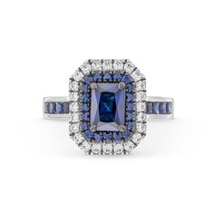 an engagement ring with blue and white diamonds