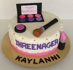 a birthday cake decorated with makeup and personalized name on the top is for kaylanni