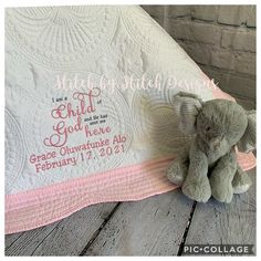 a teddy bear sitting on top of a blanket with the words, happy birth day