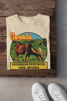 Keywords: UNISEX Vintage Canada T-Shirt | Algonquin Provincial Park Hoodie | Ontario Sweatshirt, Outdoor Tee, Road Trip Top, Camping Clothes, Camper Shirt Nature Canadian Sweater Canada National Park ------------------------------------------------ QUALITY This T-shirt is a UNISEX t-shirt with a vintage illustration and it feels soft and light, with just the right amount of stretch. It features a crew neck, pre-shrunk fabric and side-seamed fit. FIND YOUR SIZE Please find the fitting guide in the pictures to determine your size. Pro Tip: Choose the best size by comparing the measurements of your favorite T-Shirt with the ones listed on the chart. SHIPPING We work with a reliable, high-quality print-on-demand partner with locations in US and the EU, so depending on the destination your orde Camping Sweater, Algonquin Provincial Park, National Park Sweatshirt, Canada Shirt, Camping Clothes, Camp Shirts, National Park Shirt, Camper Shirt, Dad Fashion