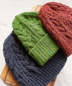 three knitted hats sitting on top of each other