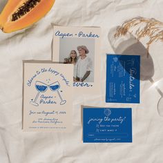 the wedding stationery is laid out on paper