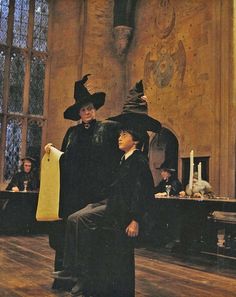 two people dressed up as witches in a room