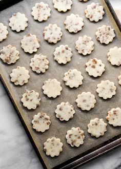 some cookies are on a baking sheet and ready to go into the oven for baking