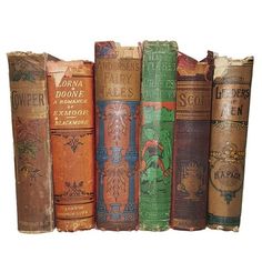 a row of old books sitting on top of each other