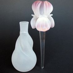 Iris Flower Perfume Bottle of Hand Blown Glass Crystal Artist: Kevin Prochaska, glass blower at Disneyland for more than 10 years Material: Borosilicate Crystal, Sand Etched Borosilicate Crystal, 24K Gold Dimensions: Height 5 inches, Width 2 inches, Volume 2 oz. Weight: 2 oz. Suggested Retail: $199.00 This lovely iris perfume decanter is unusual in both design and color and holds up to two ounces of your favorite perfume. I make it entirely by hand from borosilicate crystal and etch it with sand Flower Perfume Bottle, Iris Perfume, Pretty Objects, Empty Perfume Bottles, Flower Perfume, Y2k Background, Arts And Crafts House, Iris Flower, Ceramic Fish