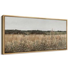 a field with tall grass and wildflowers in the foreground, framed on a wall