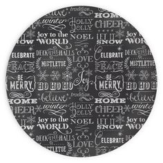 a black and white plate with words written in different languages on the front, along with an image of snowflakes