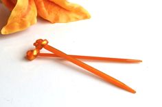 This is a lovely set of Acrylic Hair Sticks in orange color. They have a total overall length of approximately 6.30 inches (16 cm) each.  These Acrylic Hair Sticks were made for when you want something simple, colorful and water proof. These are about the size of a pencil. You can also see our new shops: ►Beautiful Jewelry & Accessories: https://www.etsy.com/shop/BellaDonnaBG?ref=l2-shopheader-name ►Art & Jewelry Shop: https://www.etsy.com/shop/CateArtShop?ref=l2-shopheader-name ►Vintage and Han Adjustable Orange Metal Jewelry, Cheap Orange Hand-strung Jewelry, Orange Hair Clips, Orange Flower Claw Clip, Elegant Orange Clip-on Earrings, Stick Pins, Trendy Accessories, Hair Sticks, Asian Style