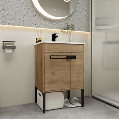 a bathroom with a sink, mirror and toilet paper dispenser