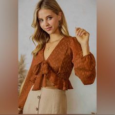 Available In Cream And Basil Display Picture Cinnamon Chic Orange Top For Brunch, Trendy Brown Blouse For Brunch, Orange Blouse For Fall Day Out, Orange Fall Blouse For Day Out, Chic Orange Blouse For Brunch, Chic Orange Fall Blouse, Cropped Workout Top, Textured Crop, Bow Crop Tops